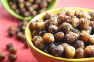 Sweet and Spicy Roasted Chickpeas are your next favorite snack! They're easy to prepare. You can spice them up any way you like and they're done in a flash!