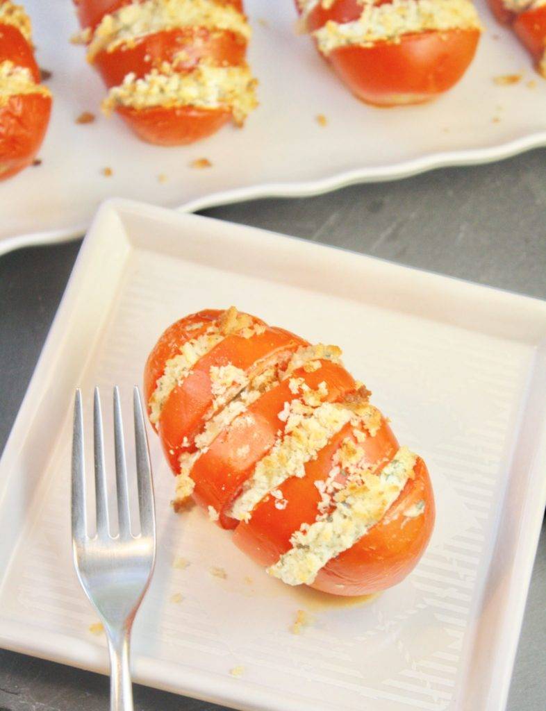 A quick and easy side dish recipe, like these Hasselback Tomatoes with Goat Cheese & Herbs, is a great thing to have in your back pocket. Bonus points if it’s delicious and impressive enough to serve for guests. Enter Hasselback Tomatoes. Yes, tomatoes!  The term Hasselback is usually applied to potatoes that are thinly sliced, accordion-style, seasoned and then baked. The end result is potatoes with the crispiest of edges and soft, creamy centers. Tomatoes get the treatment in this recipe that is just the tasty side dish you're looking for! 