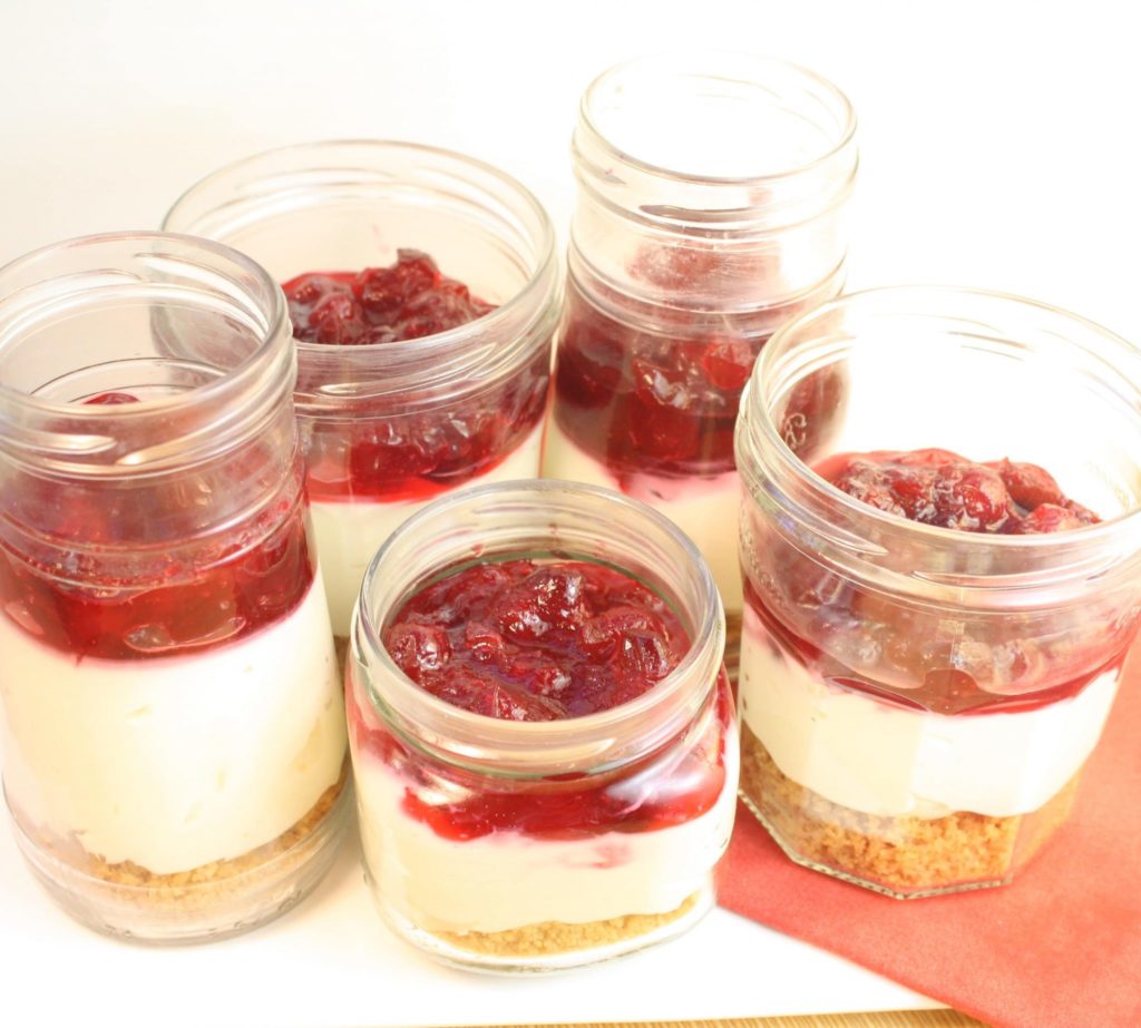 These No Bake Cranberry Cheesecake Jars are the answer to your potluck prayers. See, they're cheesecake (so, yum). They're no bake (so, simple). They're easy to transport AND pre-portioned (so, no spills all over your car or interrupting your fun to slice and serve). Most importantly, they taste like cheesecake heaven and are cute to boot!