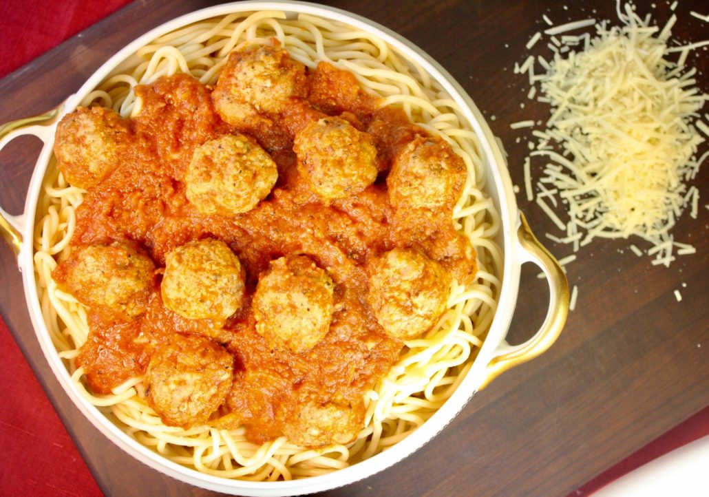 Ground turkey vs ground beef, turkey is tops in this Spaghetti & Turkey Meatballs recipe. Tender turkey meatballs gently simmered in a quick tomato sauce and you can have a hearty meal on the table in no time!!