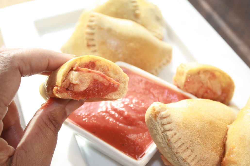 Easy Pizza Pockets are the dish that keeps on giving.  They're easily customizable. Have a picky eater? These are a perfect snack or dinner choice because you can fill them YOUR favorite pizza toppings - sausage, sautéed mushrooms, even pineapple.