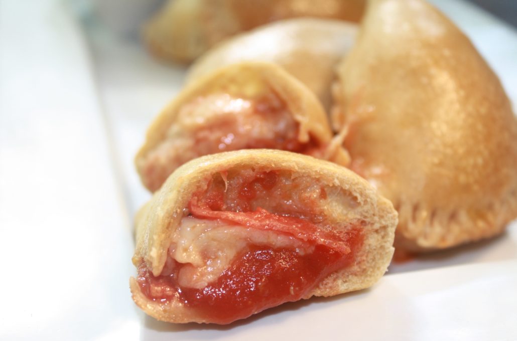 Easy Pizza Pockets are the dish that keeps on giving.  They're easily customizable. Have a picky eater? These are a perfect snack or dinner choice because you can fill them YOUR favorite pizza toppings - sausage, sautéed mushrooms, even pineapple.
