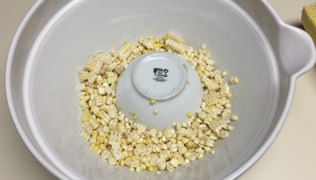 Corn Kernels in Large Bowl around Small Bowl