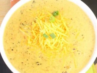 Bowl of broccoli cheddar potato soup on a colorful placemat